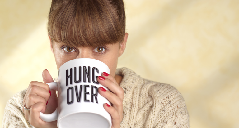 Woman with hangover with coffee