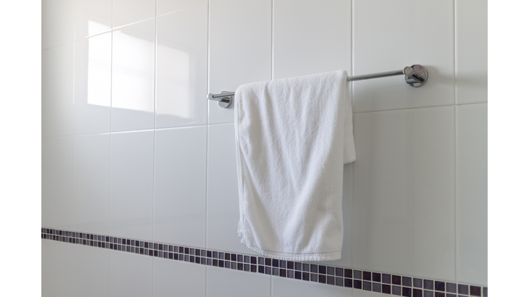 Towel Hanging On Railing In Bathroom