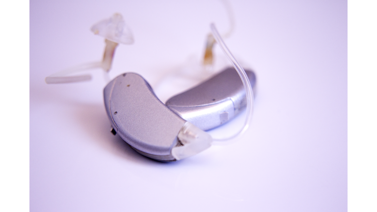 Close-Up Of Hearing Aid Against White Background