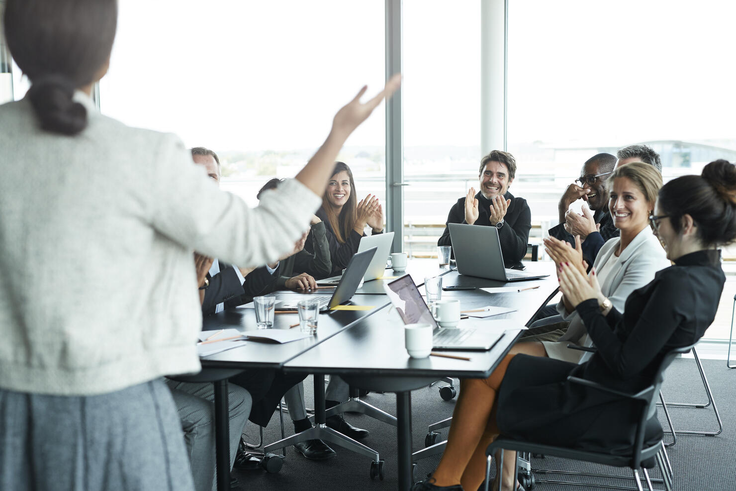 Businesswoman doing presentation in big boardroom