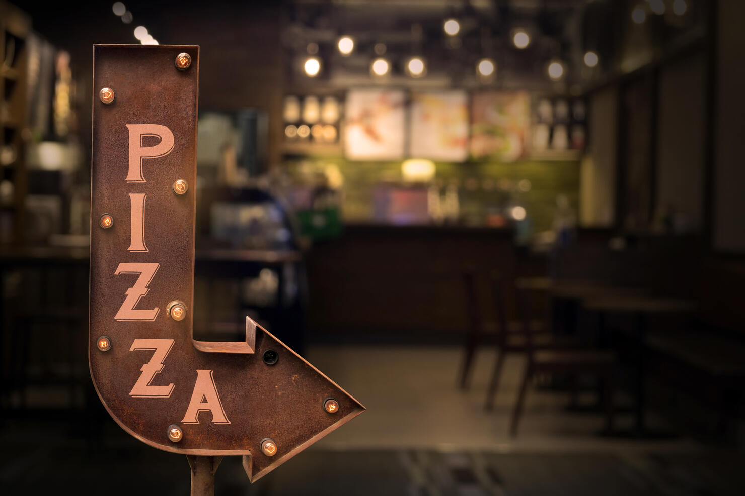 Pizza shop signboard, in front of the store