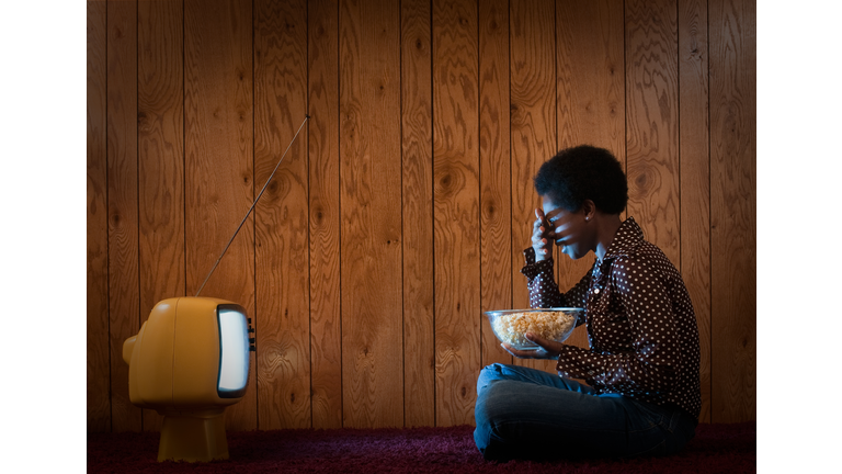 Woman watching scary movie