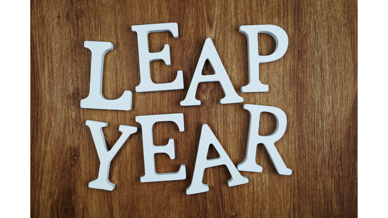Leap Year alphabet letter with space copy on wooden background