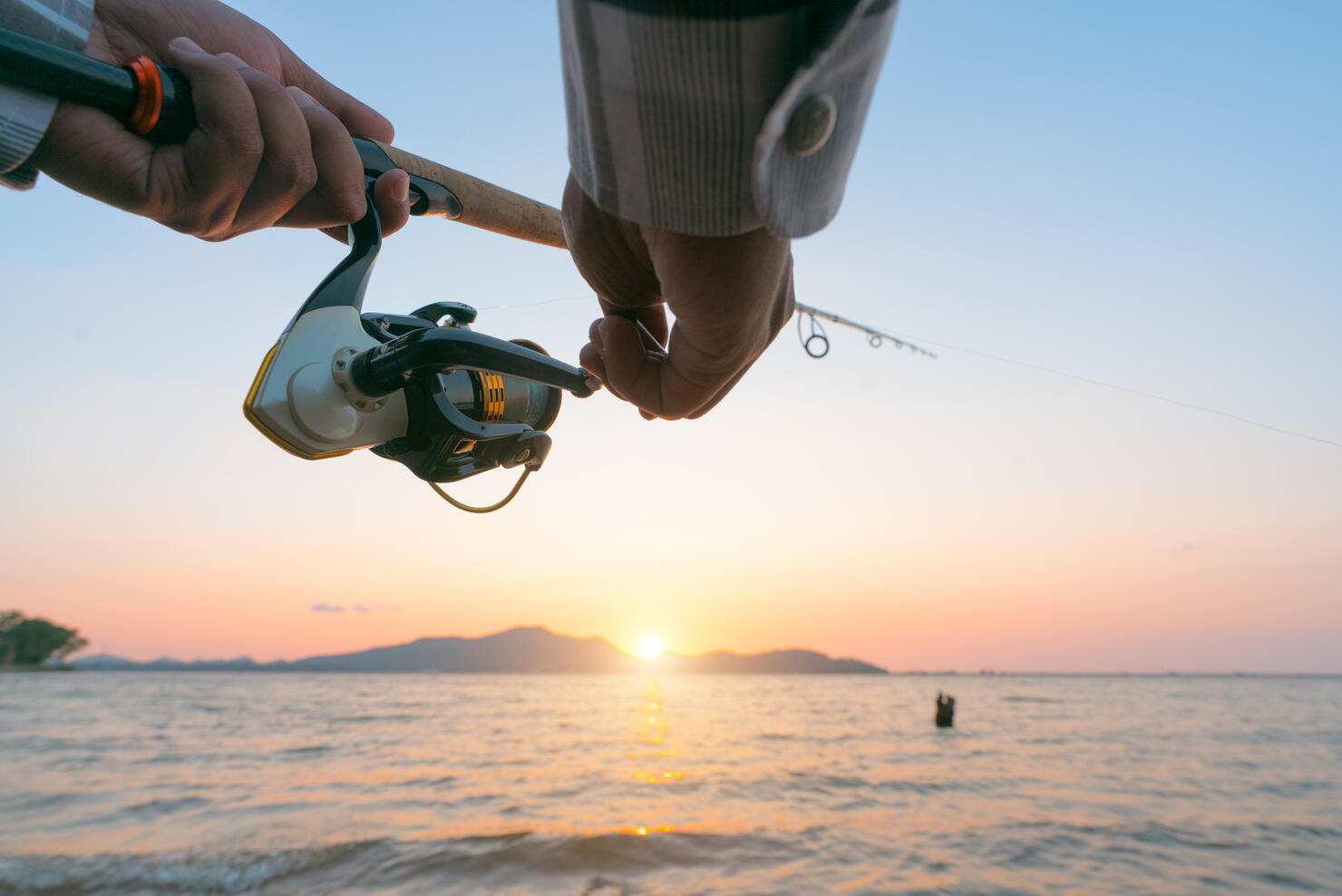 Fishing on the lake at sunset. Fishing background