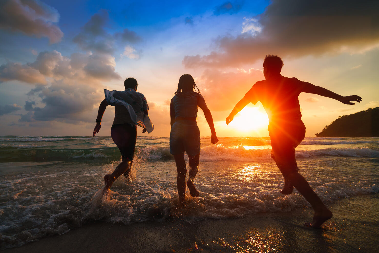 Family playing on beach