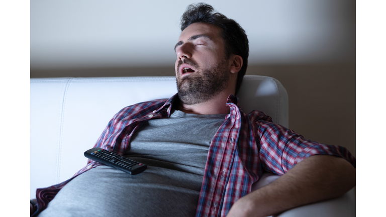 Portrait of one caucasian man watching tv