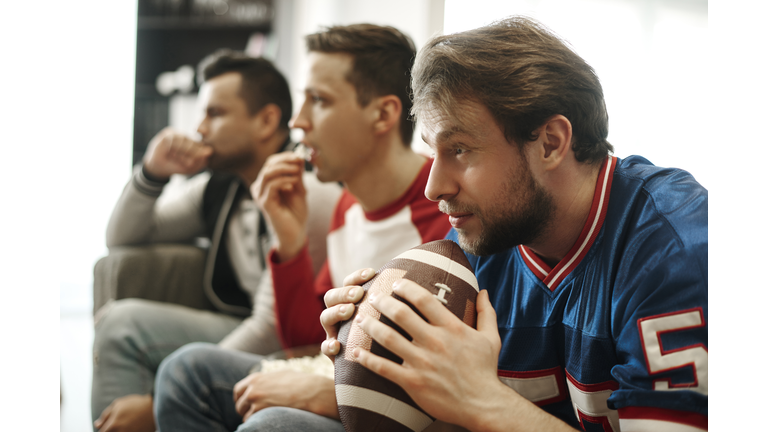 Focused watching football game at home. Debica, Poland