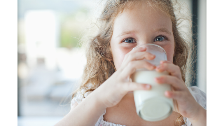 Girl drinking glass of milk