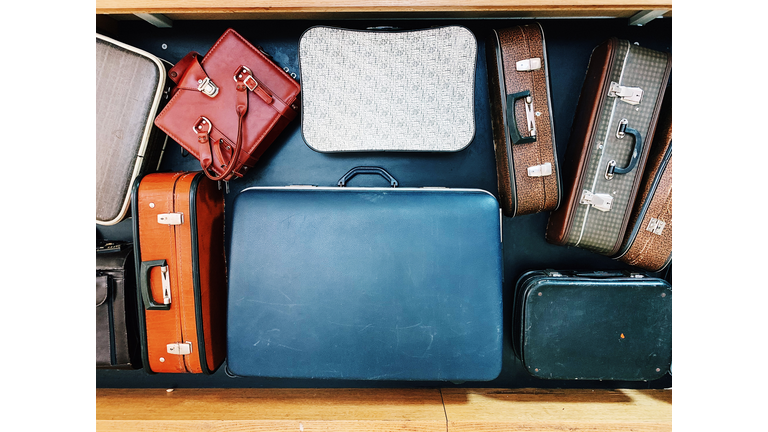 Vintage bags and suitcases on conveyor belt in an airport
