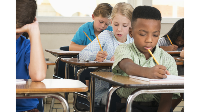 Students taking test in classroom