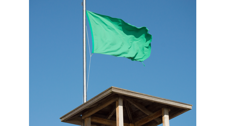 Green flag on lifeguard