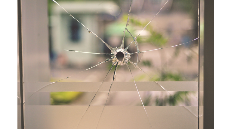 Bullet Hole on Glass Window