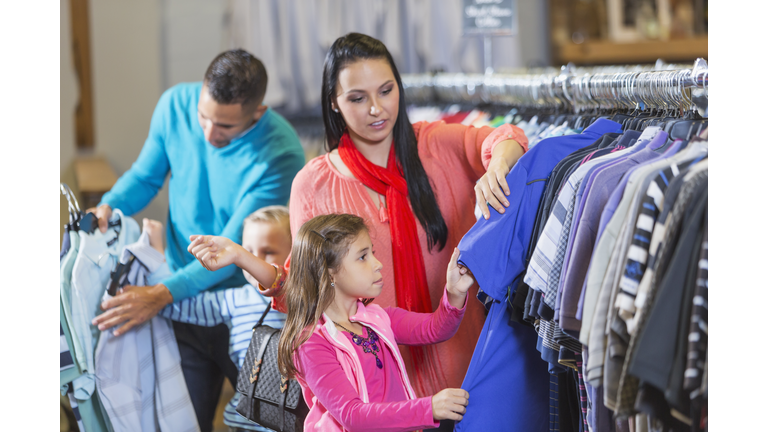 Family shopping in clothing store