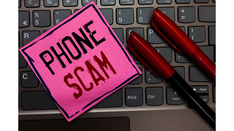 Writing note showing Phone Scam. Business photo showcasing getting unwanted calls to promote products or service Telesales Pink paper keyboard Inspiration communicate ideas messages Red markers.