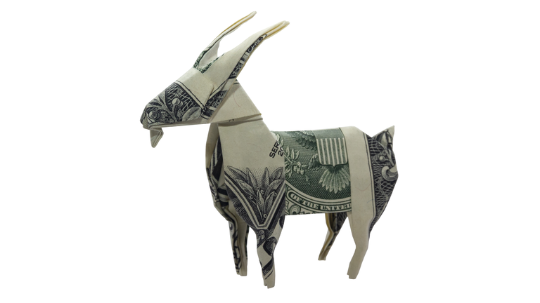 Money Origami GOAT Capricorn Zodiac Animal Folded with Real One Dollar Bill Isolated on White Background