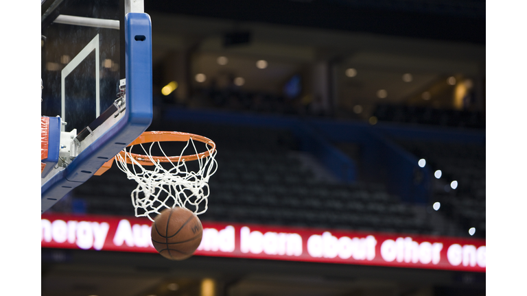 Basketball in hoop, blurred motion