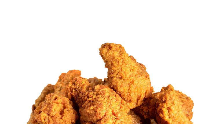 Fried chicken or crispy kentucky isolted on white background. Delicious hot meal with fast food.