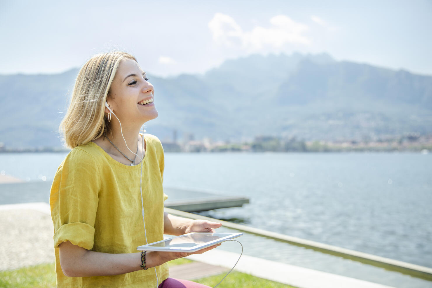 Young Woman Listening Podcast with Digital Tablet