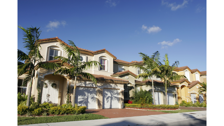 A beautiful house for a single family with palm trees