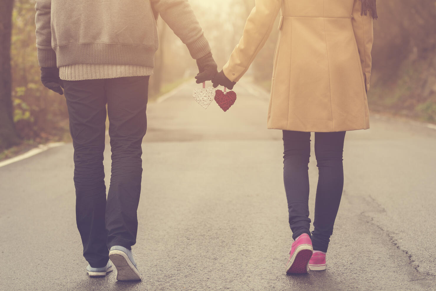 Couple in love holding hearts.