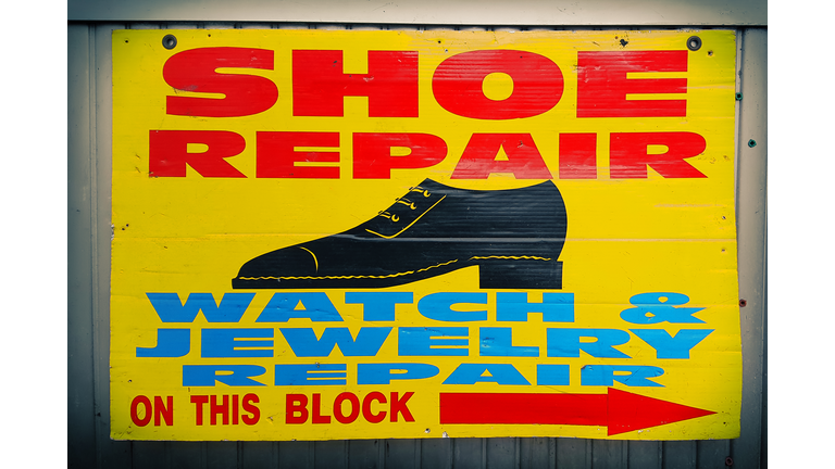 Store sign of shoe repair shop in New York City, USA