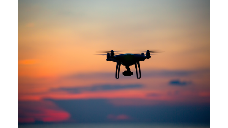 The drone in sunset sky.