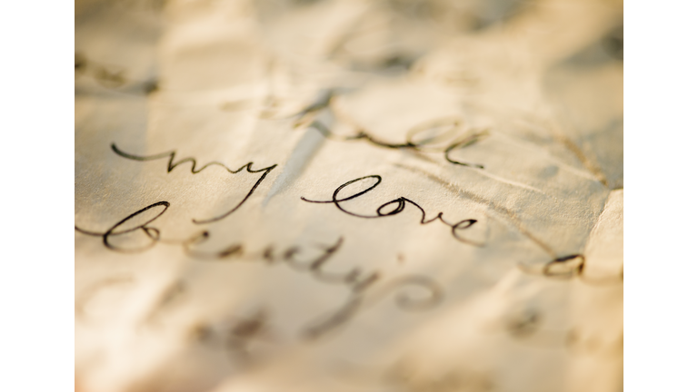 Close up of antique love letter on parchment 