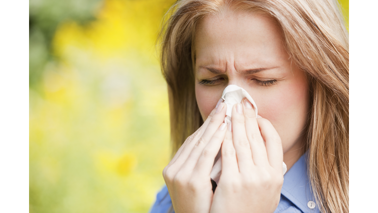 USA, New York, New York City, Manhattan, Central Park, Close up of woman sneezing