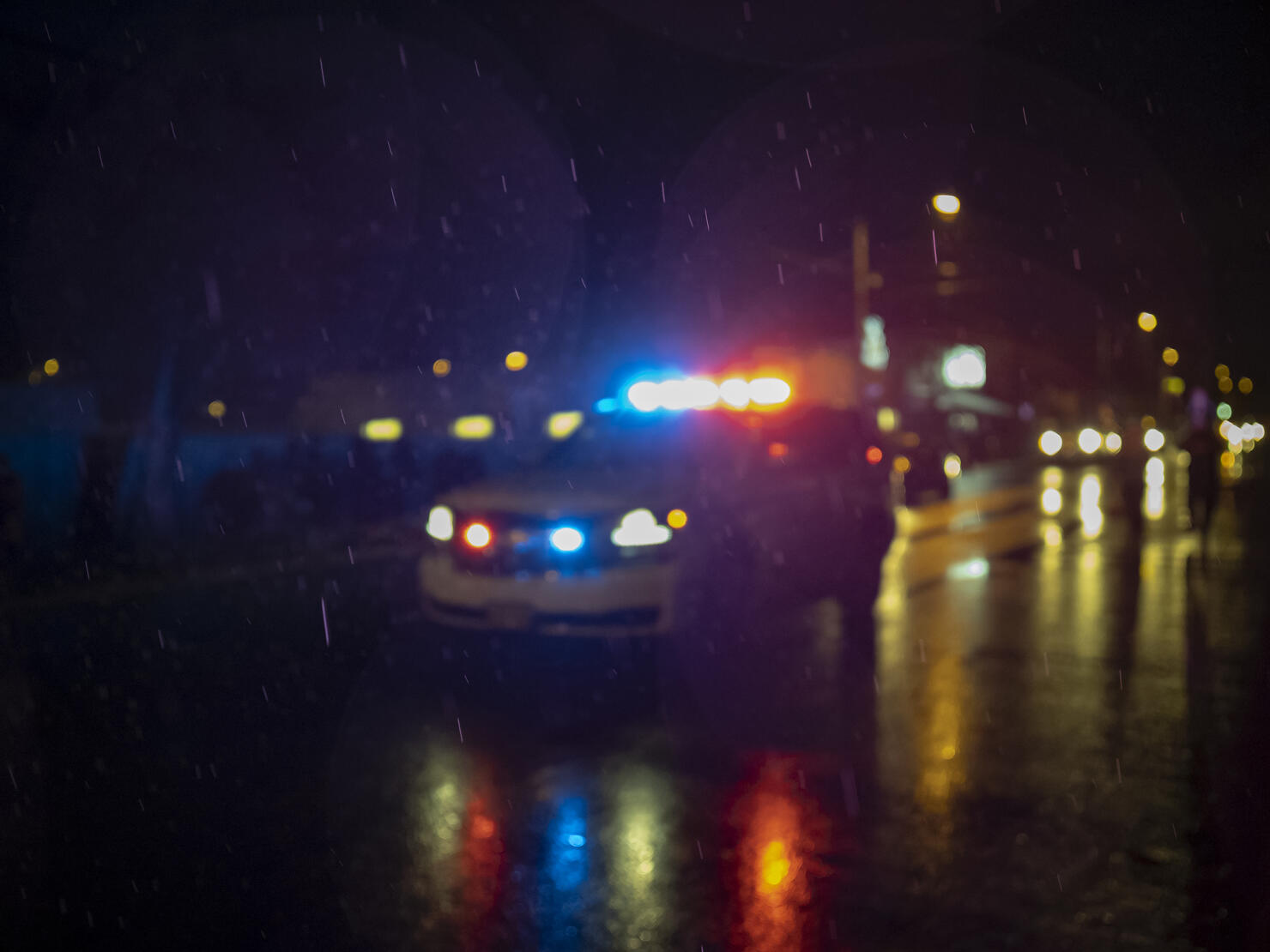 Police Car Lights Blurred Out of Focus on City Street