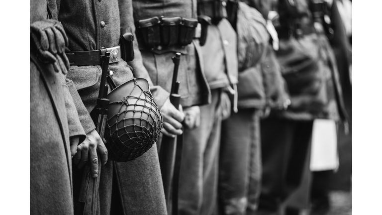 Close Up Of German Military Ammunition Of A German Soldier. World War II German Soldiers Standing Order. Photo In Black And White Colors. Soldiers Holding Weapon Rifle