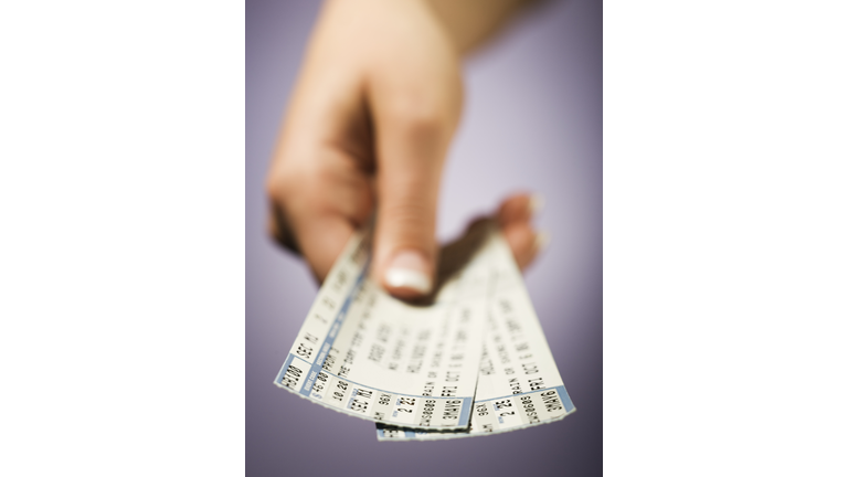 Woman giving tickets