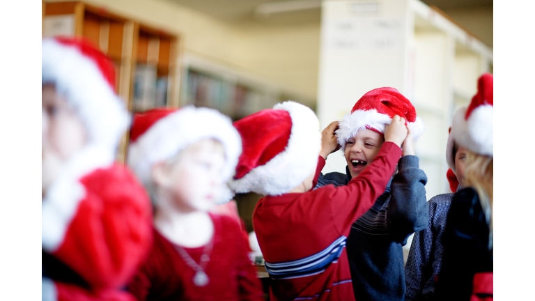 Little Santas get ready to put on a show