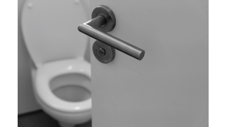 Toilet Seat Seen Through Open Door