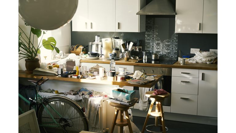 Messy apartment counter tops covered in clutter