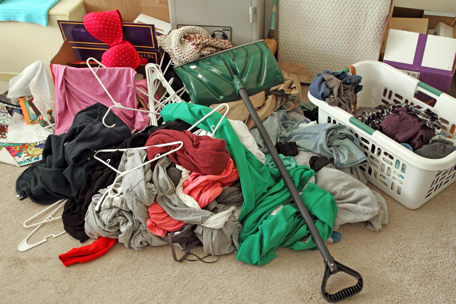 Clutter mess on a bedroom floor