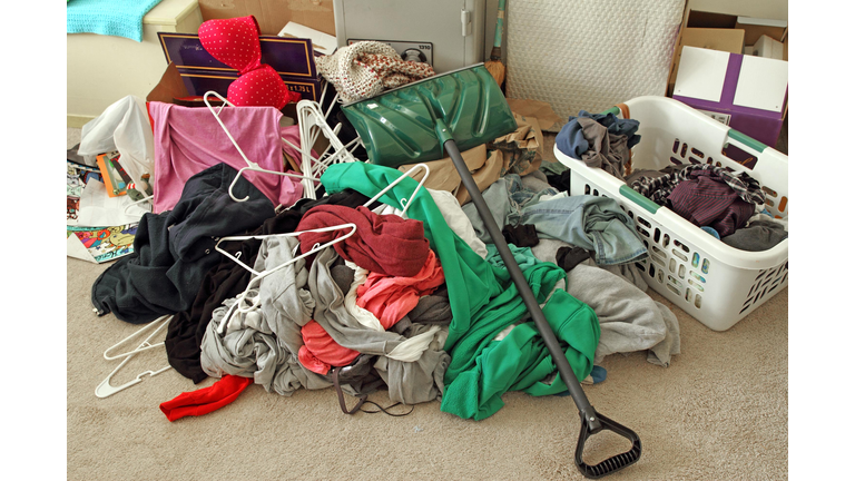 Clutter mess on a bedroom floor