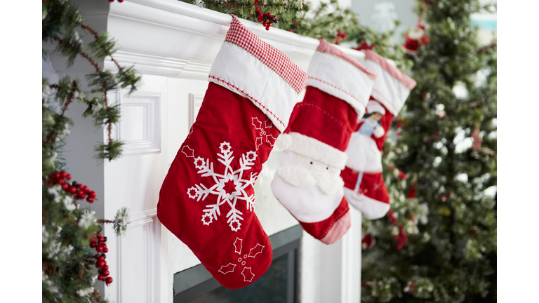 Empty Stockings Hung On Fireplace On Christmas Eve