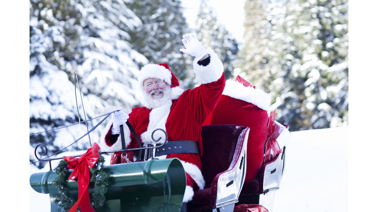 Santa Claus Sitting in His Sleigh Waving