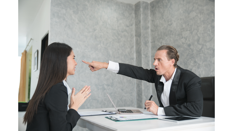 Wrathful company leader pointing guilty female employee on exit and asking to leave, scared of dismissal millennial woman begging angry boss not to fire her. Hiring manager refusing candidate in job