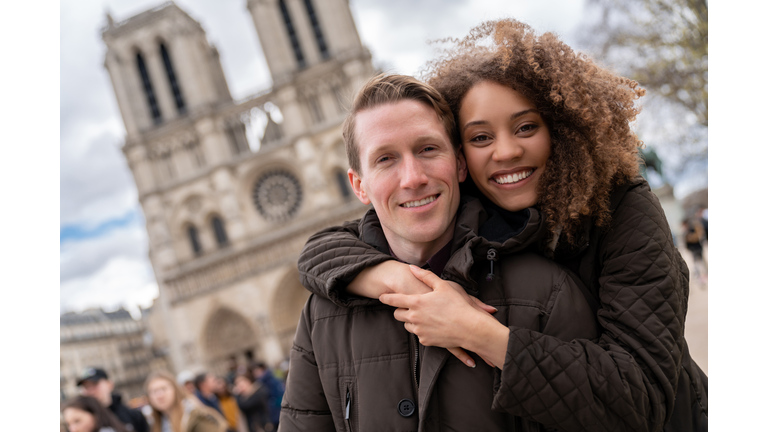 Portrait of a happy couple sightseeing in Paris