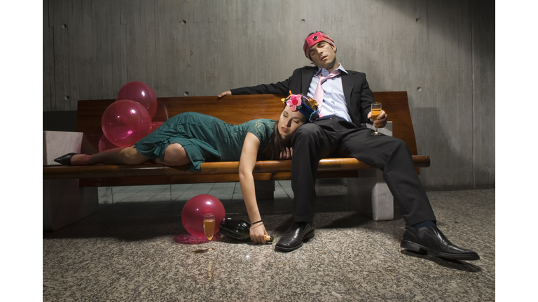 Exhausted drunk couple passed out from partying