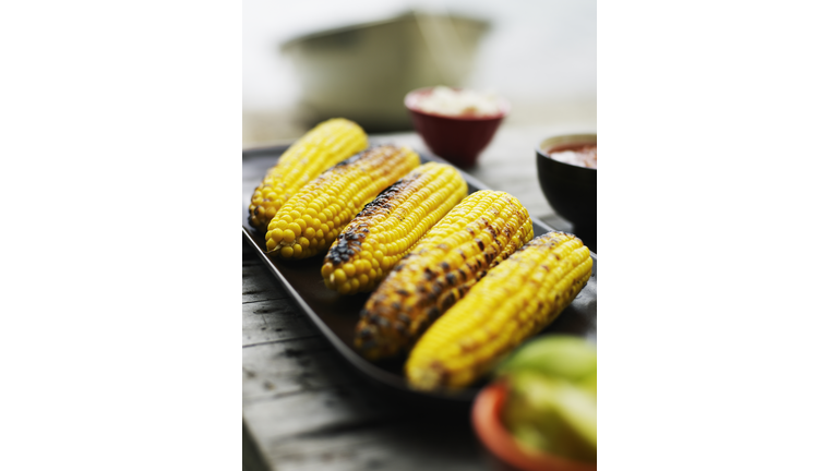 Platter of grilled organic sweet corn on the cob