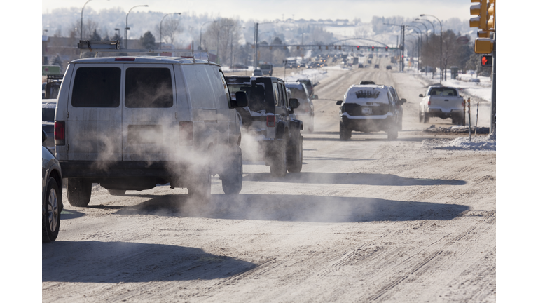 Vehicle traffic tailpipe emission pollution Littleton Colorado winter snow