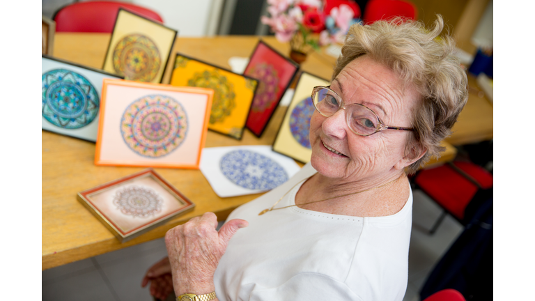 Woman Showing Hand Made Art Craft