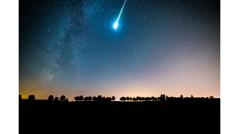 Low Angle View Of Meteor Shower And Star Field In Sky