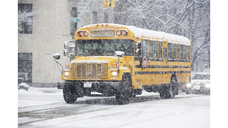 USA, New York City, school bus in blizzard