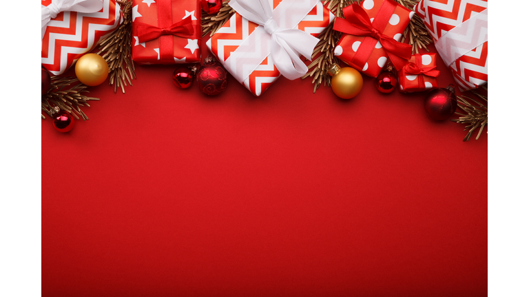 Merry christmas gift boxes background with christmas baubles
