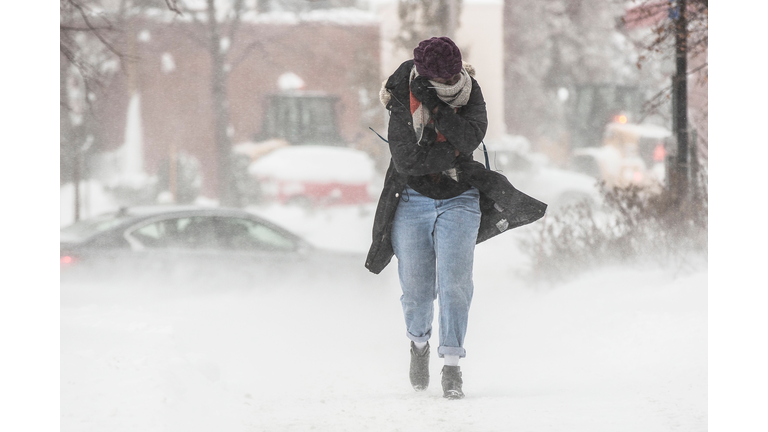 Full Length Of Woman Walking On Road During Winter