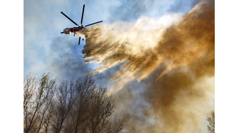 Helitanker Dropping Water on a Wildfire