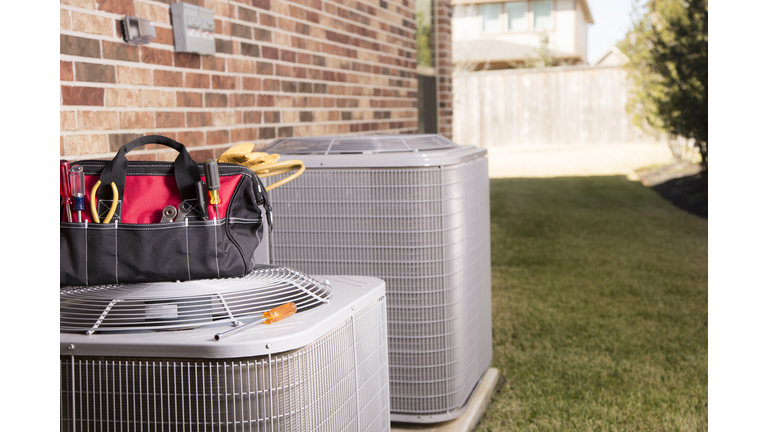 Service Industry:  Work tools on air conditioners. Outside home.